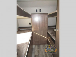 Quad bunk room up front and a rear queen bedroom with a slide in back on the Hideout 32FBTS