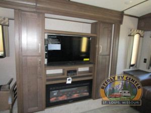 The Keystone Laredo 330RL features opposing slides and a 40" TV located above the fireplace.